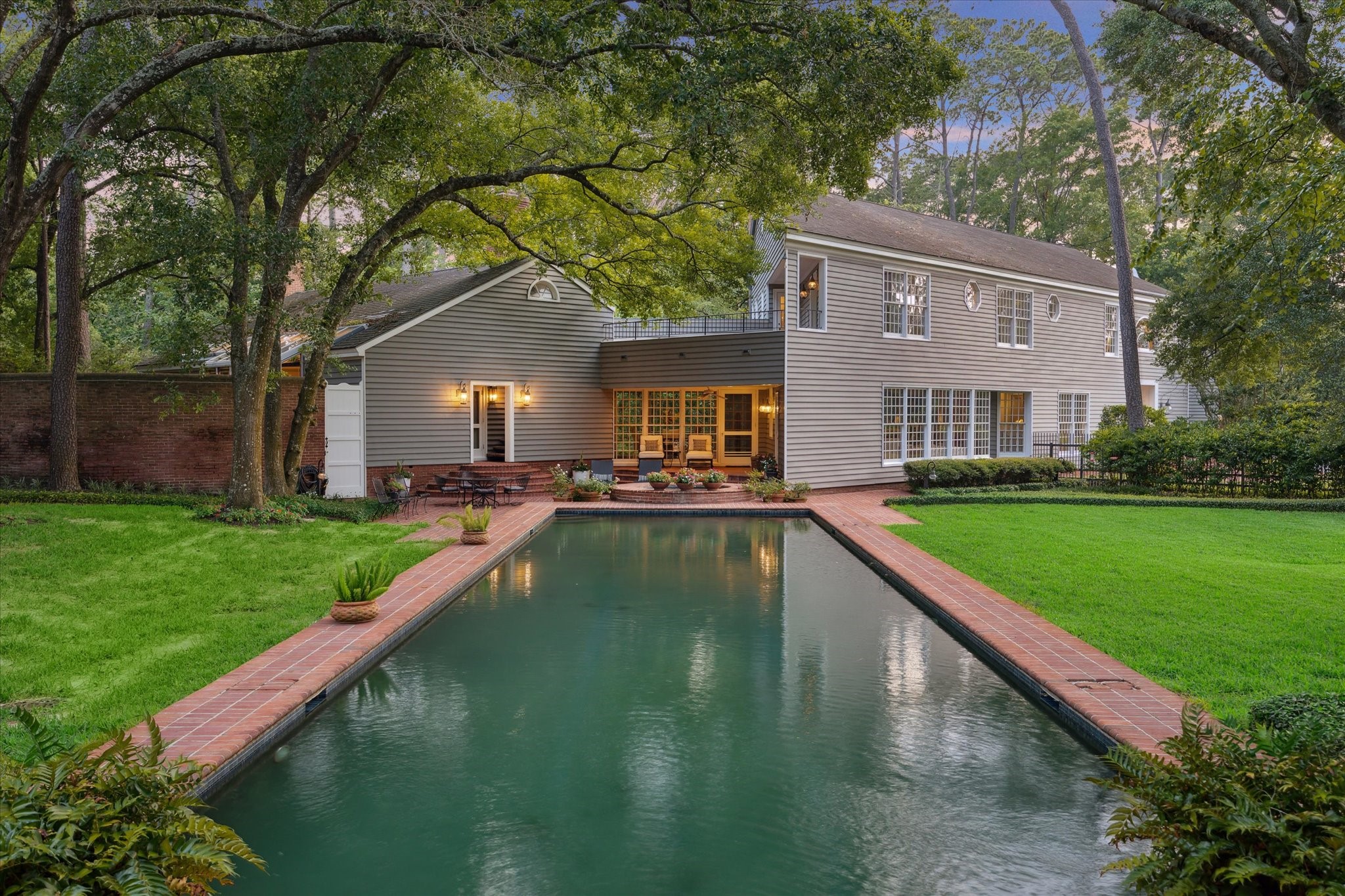 3971 Inverness Drive Houston, TX 77019 - Photo 48 of 50 a view of a house with a yard patio and swimming pool