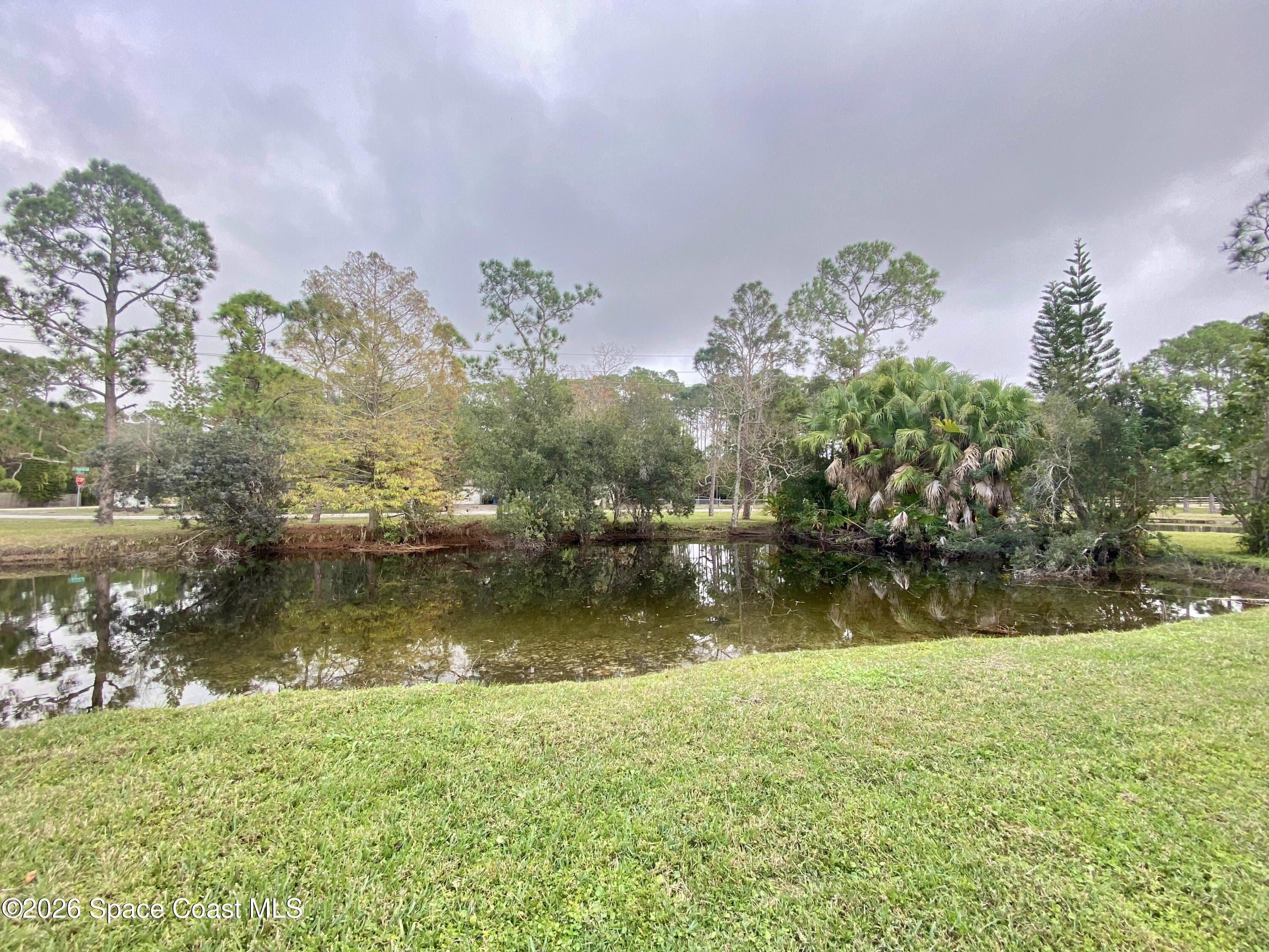 4000 Hield Road Northwest Palm Bay, FL 32907 - Photo 3 of 4 a view of lake with green space