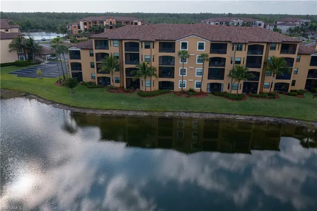 a view of house with yard and green space