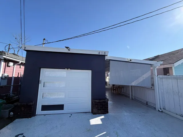 a room that has a bed and a chair in it