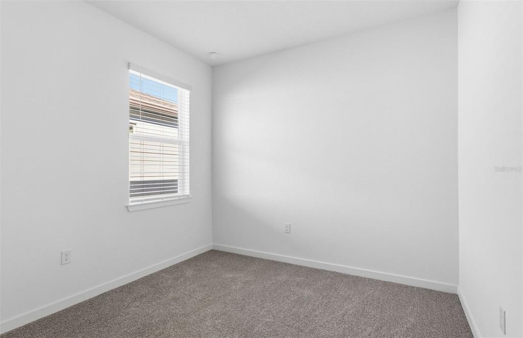 6933 Southwest 90th Place Ocala, FL 34476 - Photo 11 of 17 an empty room with a window