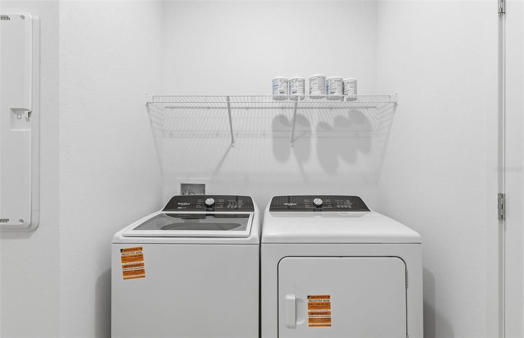 6933 Southwest 90th Place Ocala, FL 34476 - Photo 14 of 17 a utility room with dryer and washer