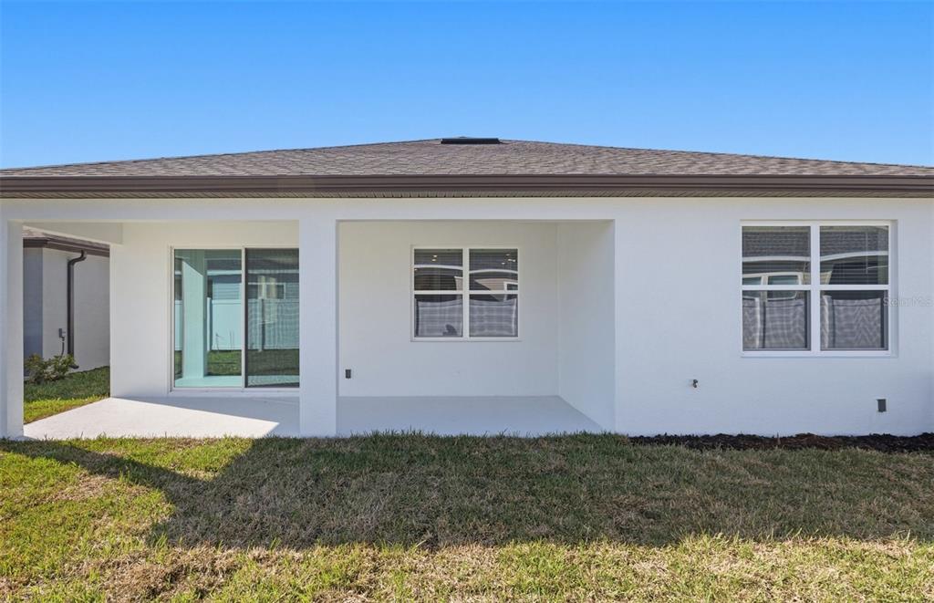 6933 Southwest 90th Place Ocala, FL 34476 - Photo 15 of 17 a view of a house with a yard