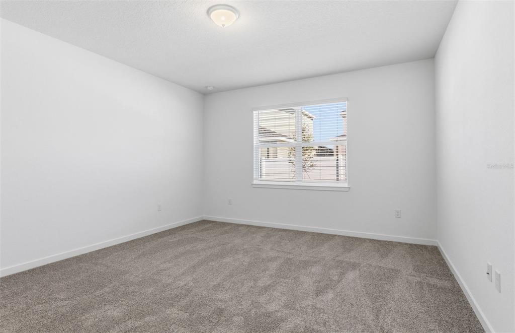 6933 Southwest 90th Place Ocala, FL 34476 - Photo 6 of 17 an empty room with windows