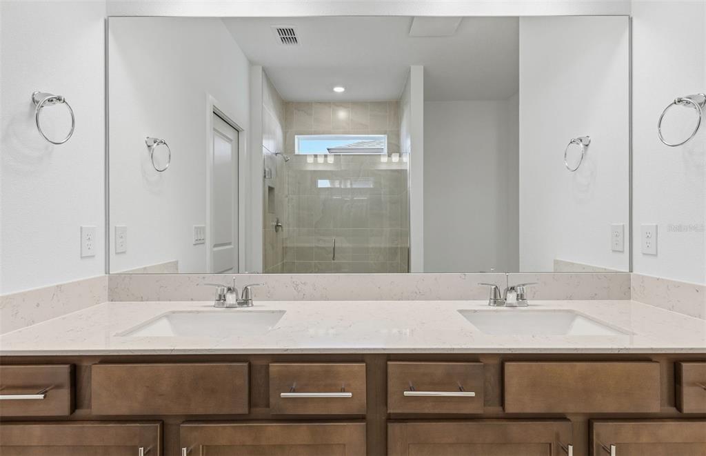 6933 Southwest 90th Place Ocala, FL 34476 - Photo 7 of 17 a bathroom with a sink and a mirror