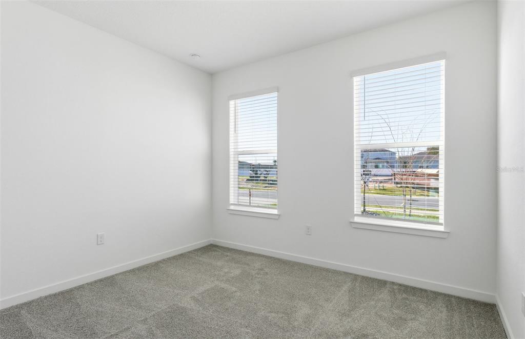 6933 Southwest 90th Place Ocala, FL 34476 - Photo 9 of 17 an empty room with a window
