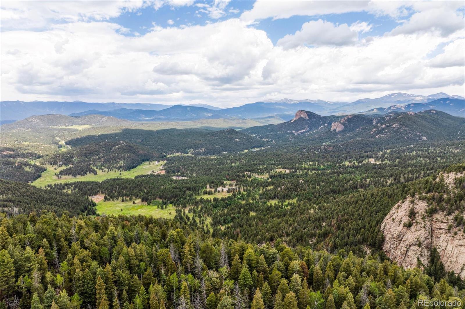 31545 Pike View Drive Conifer, CO 80433 - Photo 14 of 21 an aerial view of houses covered in trees