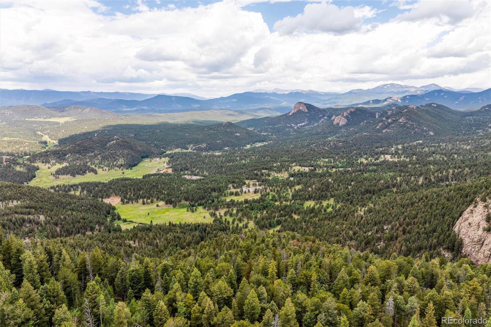 31545 Pike View Drive Conifer, CO 80433 - Photo 15 of 21 a view of a city with mountains in the background