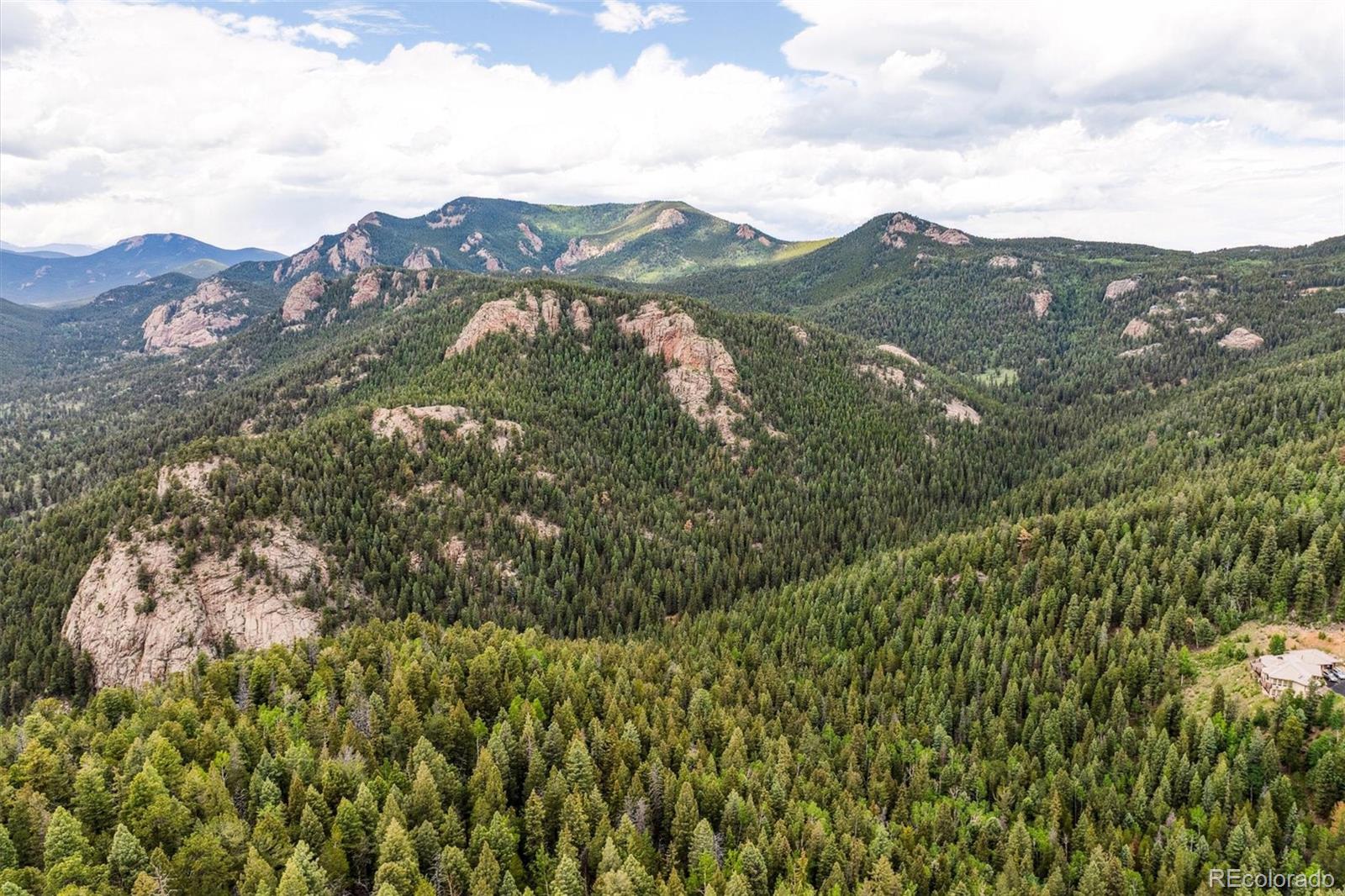31545 Pike View Drive Conifer, CO 80433 - Photo 17 of 21 a view of a city with mountains in the background