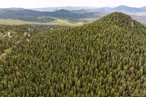 a view of an ocean from a mountain