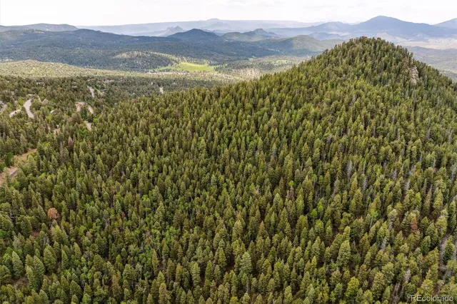 a view of an ocean from a mountain