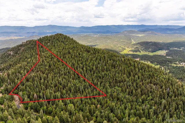 a view of mountains and valleys