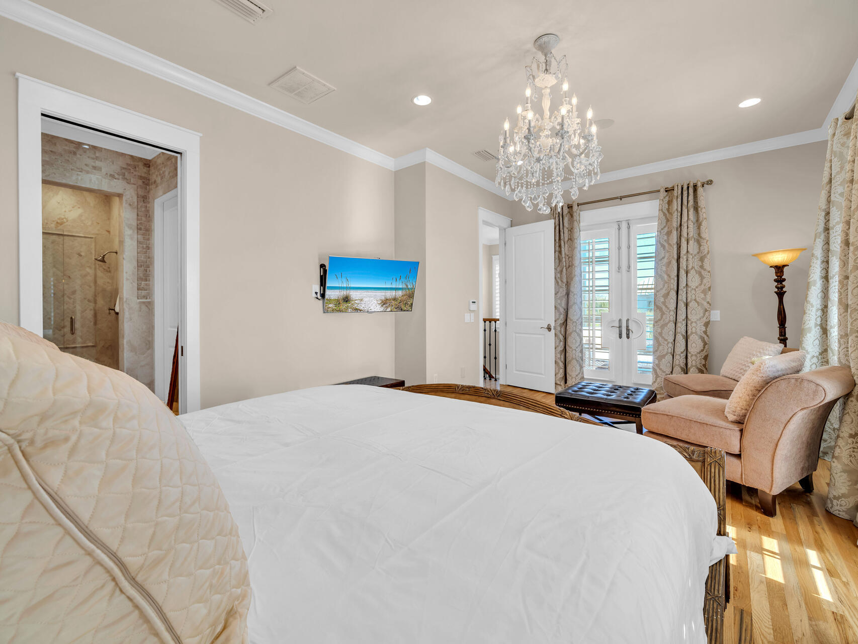 10140 East County Highway 30A, Unit 1 Inlet Beach, FL 32461 - Photo 37 of 54 a bedroom with bed and a chandelier