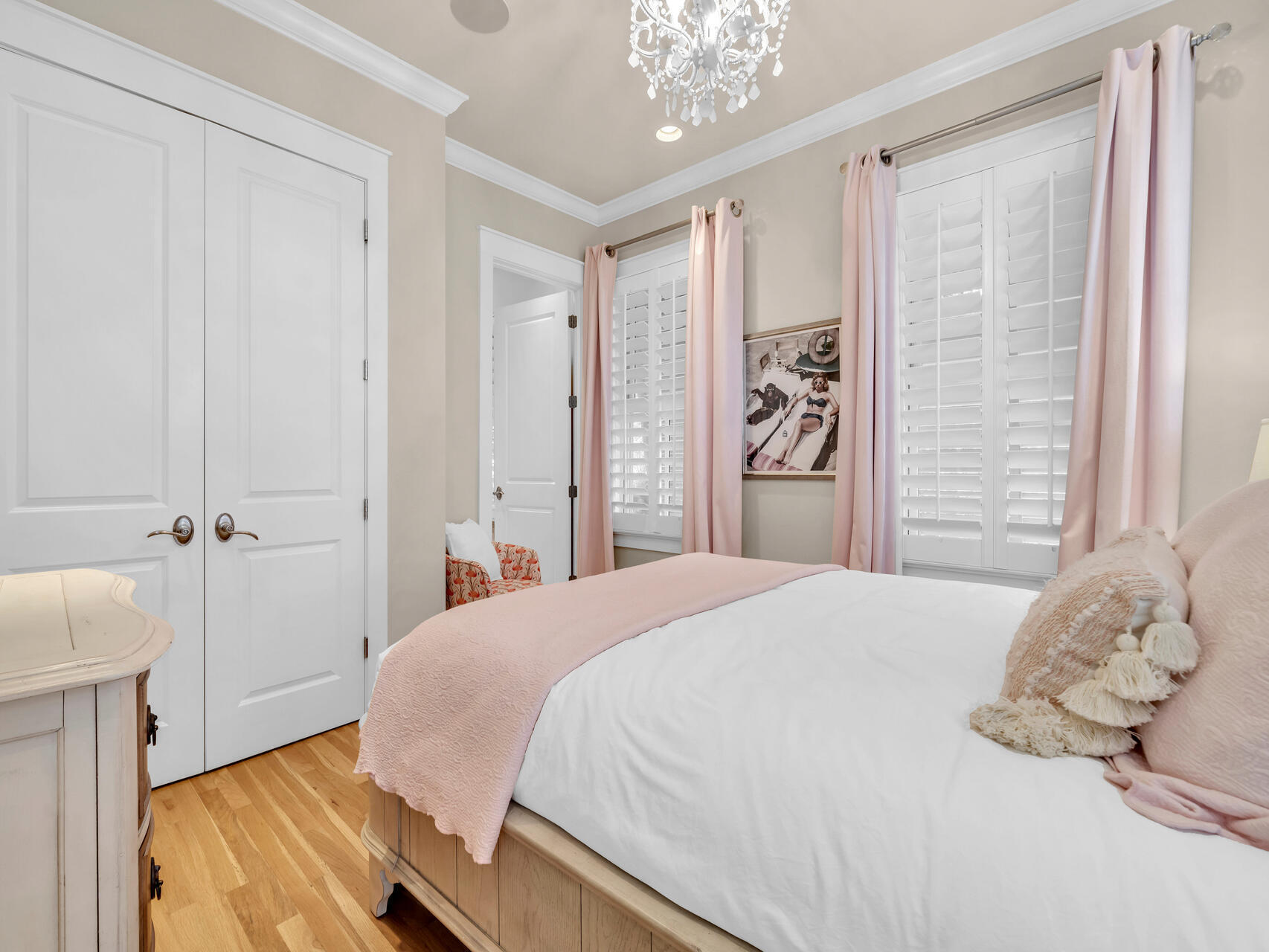 10140 East County Highway 30A, Unit 1 Inlet Beach, FL 32461 - Photo 41 of 54 a bedroom with a large bed and a chandelier