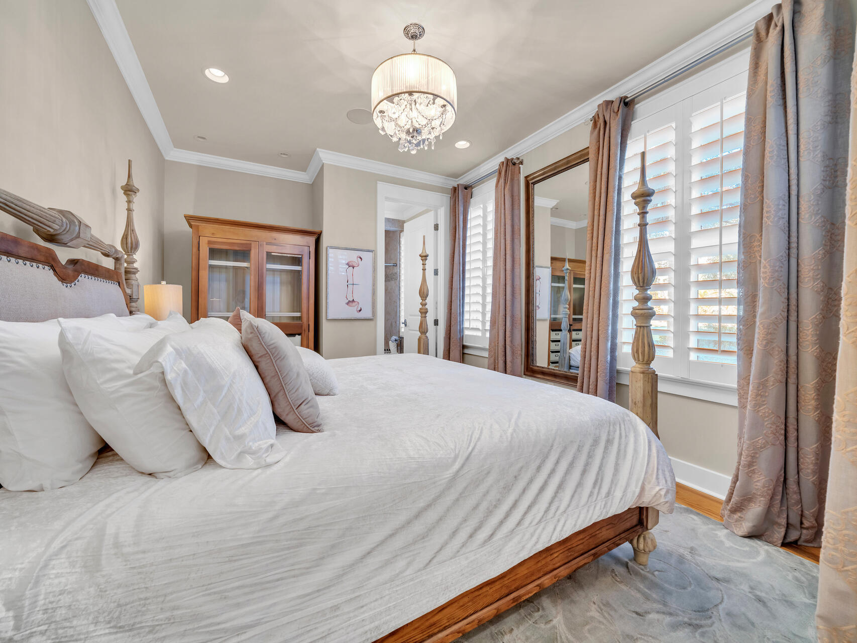 10140 East County Highway 30A, Unit 1 Inlet Beach, FL 32461 - Photo 9 of 54 a bedroom with a large bed and a chandelier