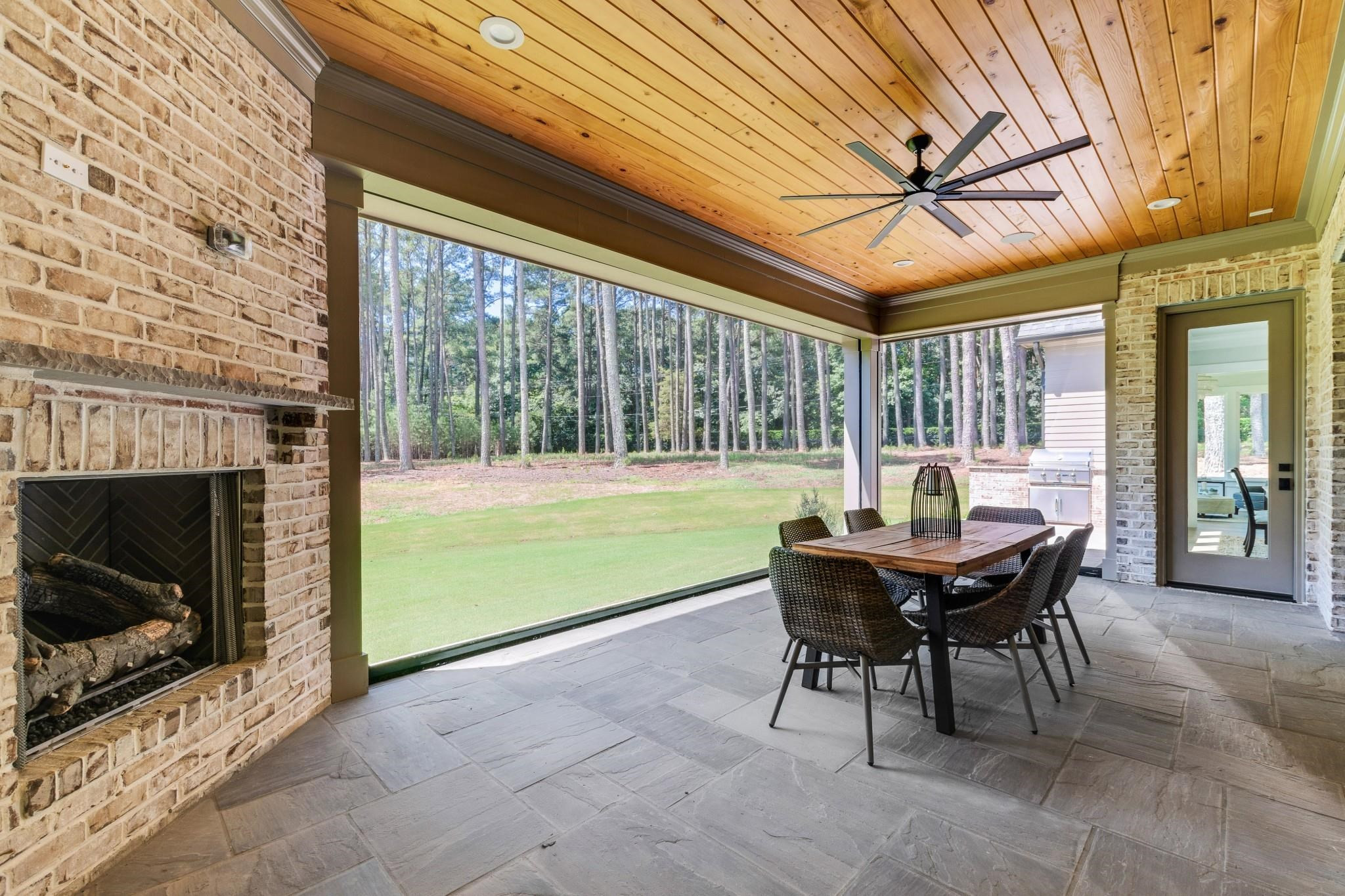 1641 Estate Valley Lane Raleigh, NC 27613 - Photo 5 of 48 Large Screened Porch with Fireplace has Adjoining Grilling Deck