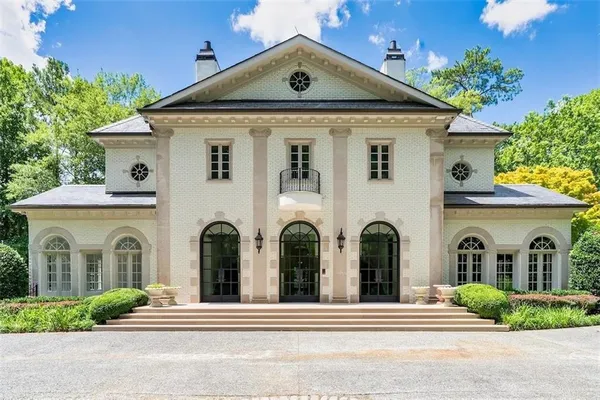front view of a house with a garden