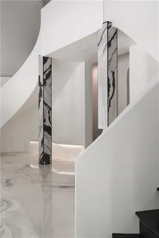 a view of a livingroom with wooden floor and a flat screen tv