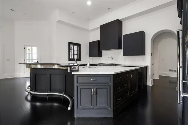 a bathroom with a granite countertop sink a toilet and a mirror