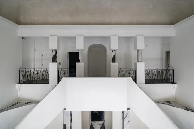 a view of a hallway with seating area