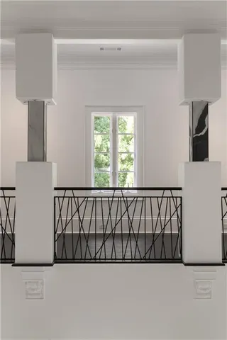 a view of a livingroom with wooden floor and a flat screen tv