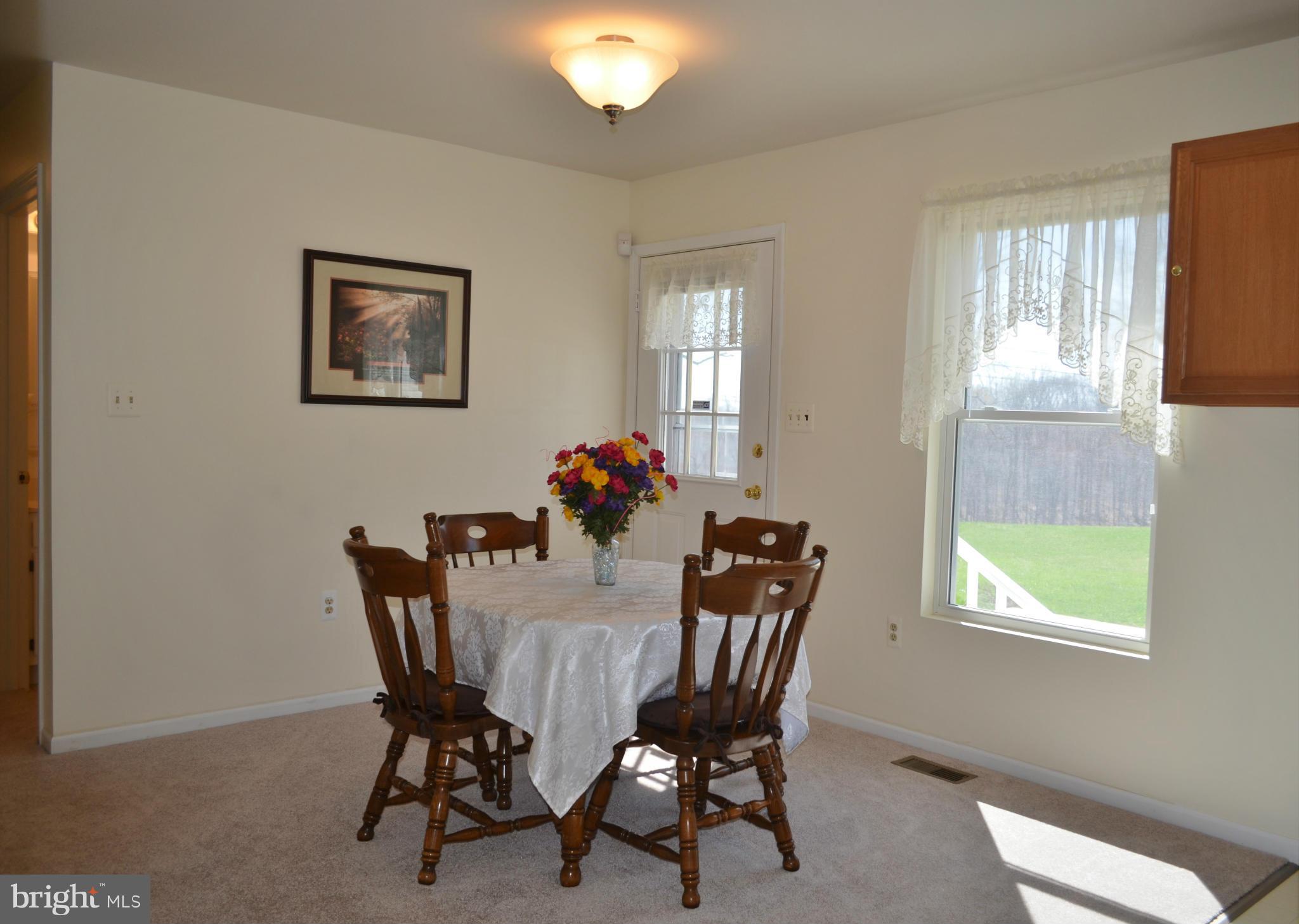 75 Fairhaven Road Tracys Landing, MD 20779 - Photo 9 of 30 a view of a dining room with furniture and window
