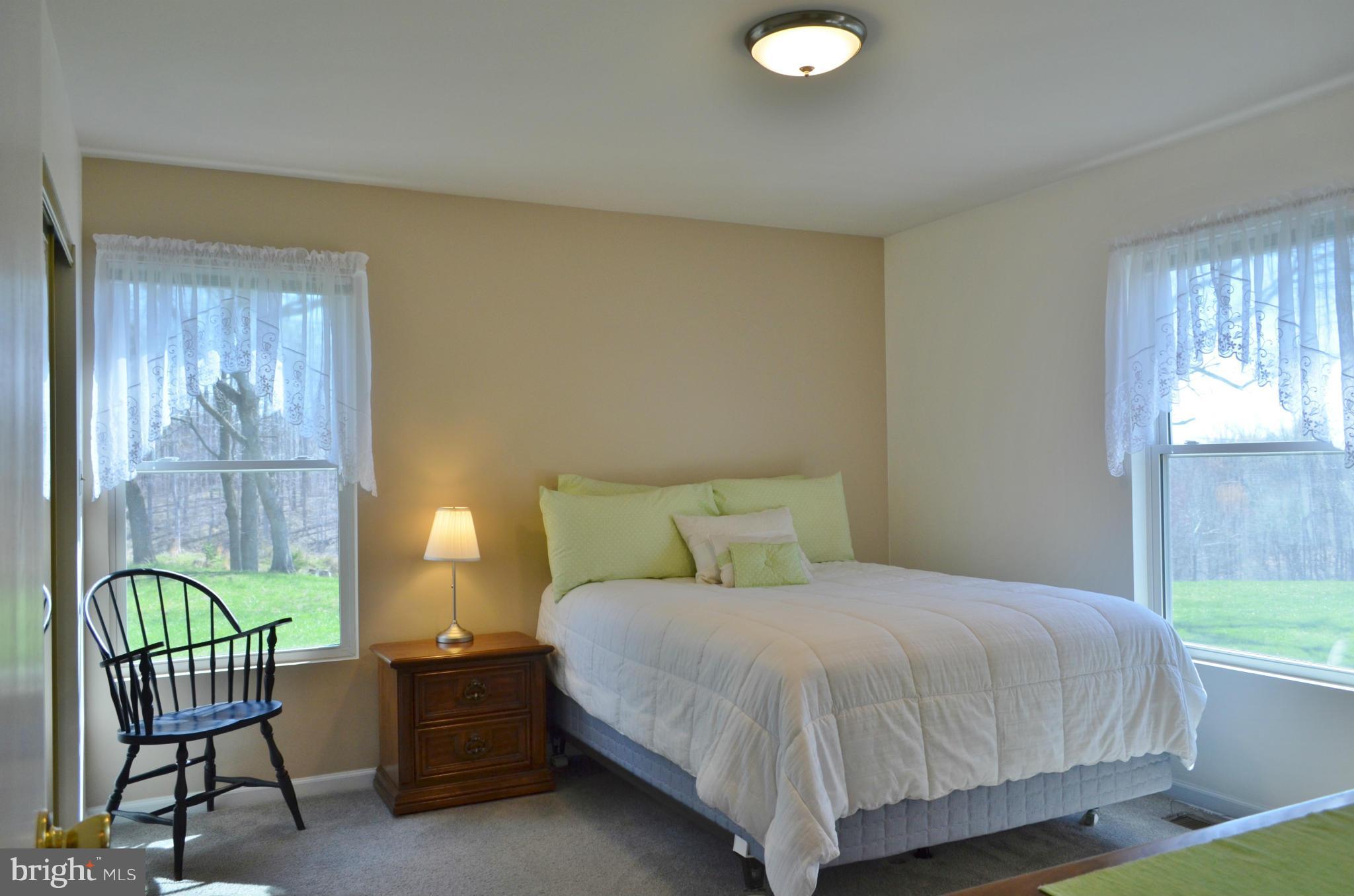 75 Fairhaven Road Tracys Landing, MD 20779 - Photo 10 of 30 a bedroom with a bed chair and window
