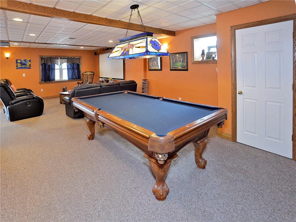 1488 Cavitt Road Monroeville, PA 15146 - Photo 17 of 23 Finished game room with bar and projector - perfect man cave!