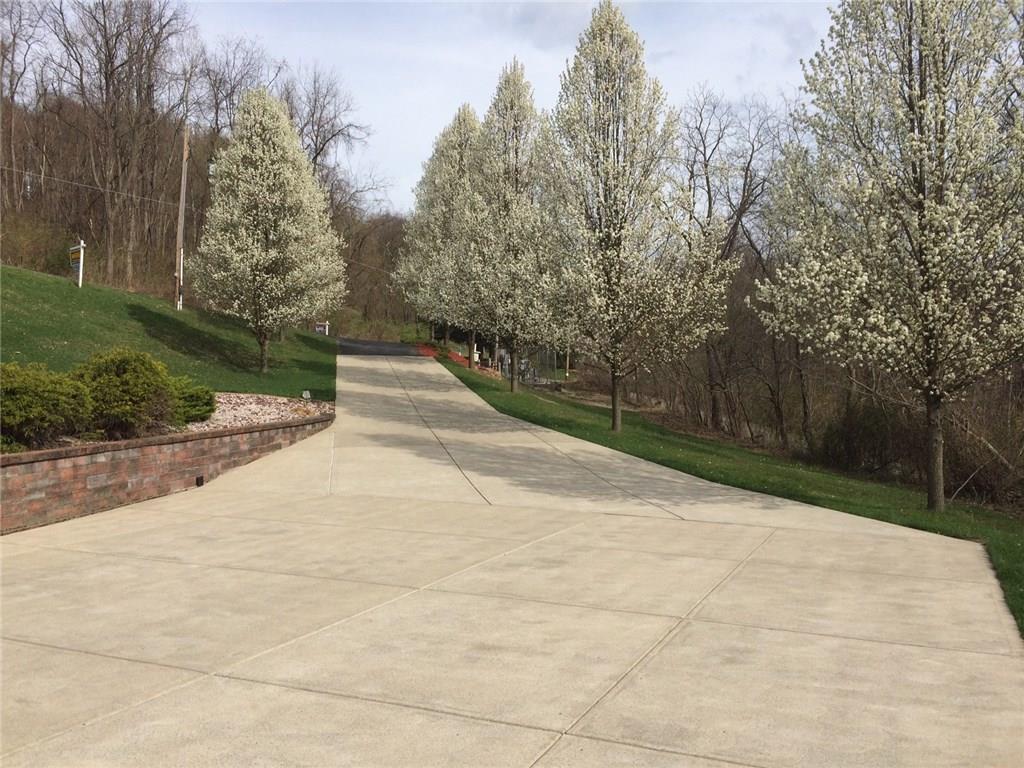 1488 Cavitt Road Monroeville, PA 15146 - Photo 22 of 23 Additional upgrades-concrete driveway-6" thick 4000psi w 10-12" stone base, Versa Lok retaining wall. Plenty of parking space for family gatherings.
