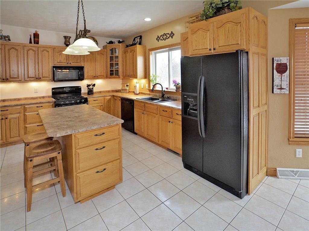 1488 Cavitt Road Monroeville, PA 15146 - Photo 5 of 23 Custom built oak cabinets with center island and ample count space.