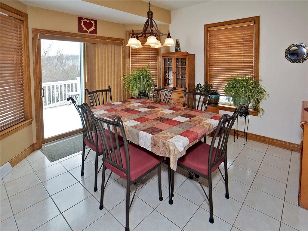 1488 Cavitt Road Monroeville, PA 15146 - Photo 7 of 23 Eat-in-Kitchen with glass slider opens to 32x12 composite deck and endless views