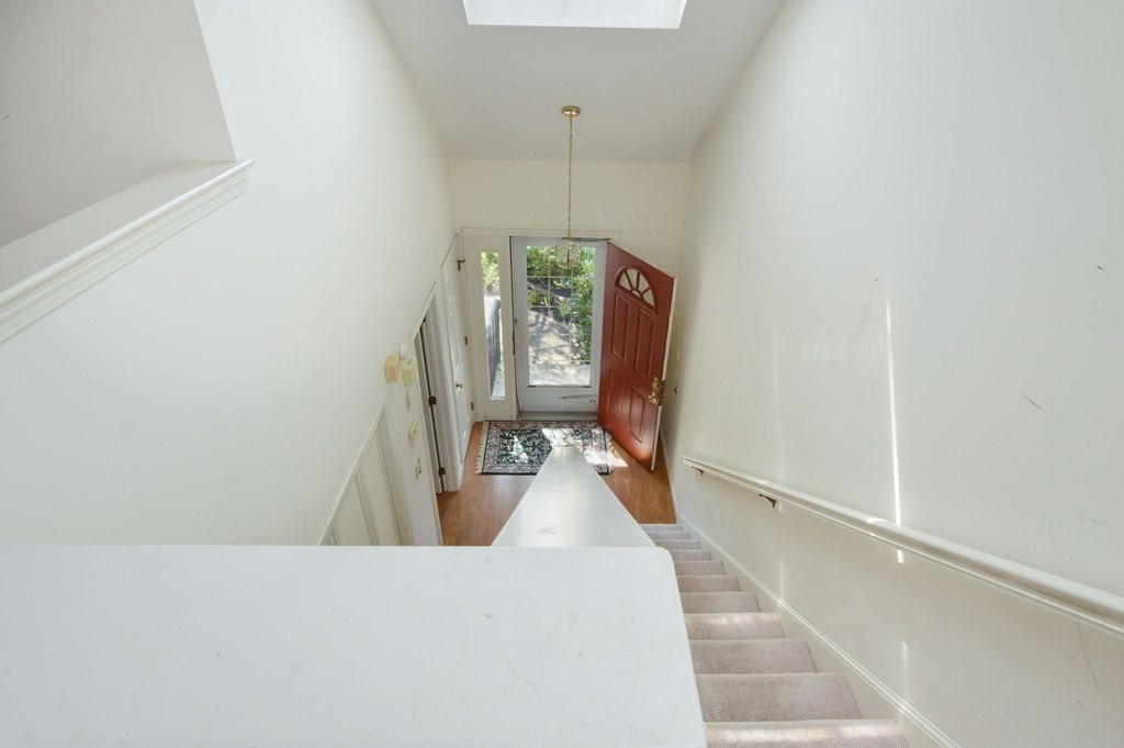 3 Kettle Lane, Unit 3 Mashpee, MA 02649 - Photo 21 of 30 a view of a living room with furniture and a chandelier