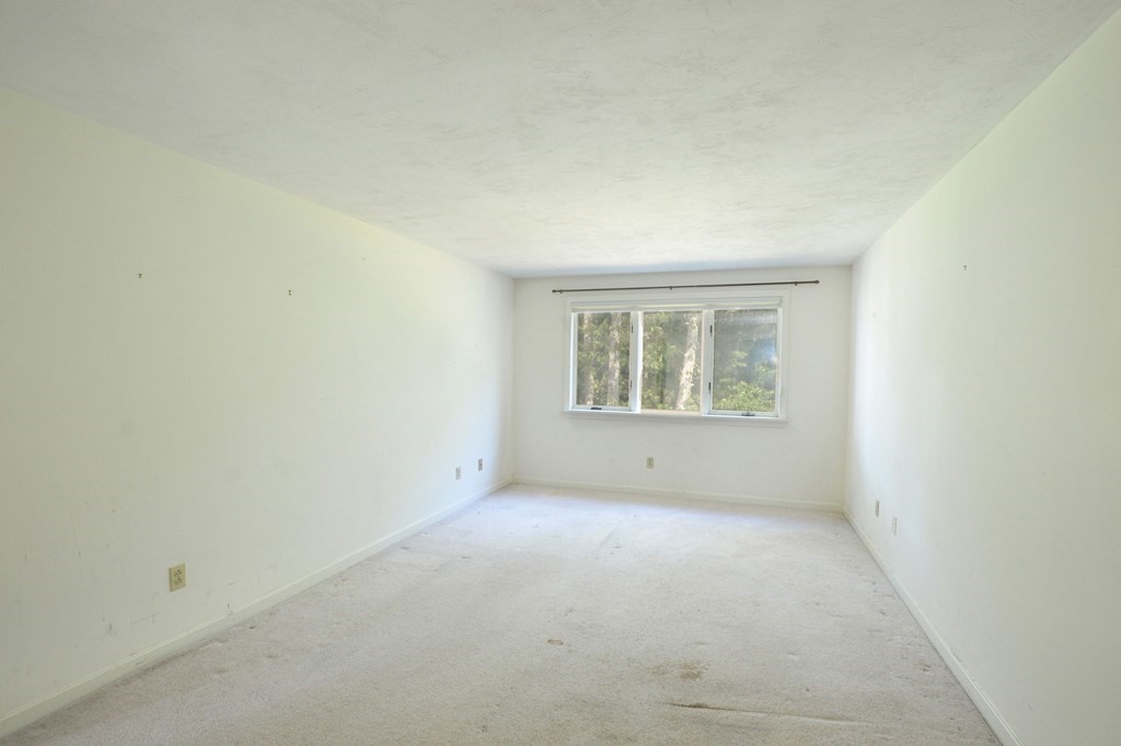 3 Kettle Lane, Unit 3 Mashpee, MA 02649 - Photo 23 of 30 an empty room with windows