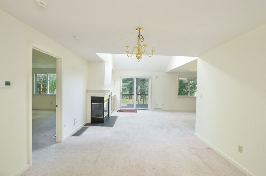3 Kettle Lane, Unit 3 Mashpee, MA 02649 - Photo 5 of 30 a view of a livingroom with a fireplace
