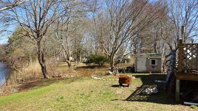 19 Everett Road Buzzards Bay, MA 02532 - Photo 14 of 30 a blue bench sitting in middle of a yard