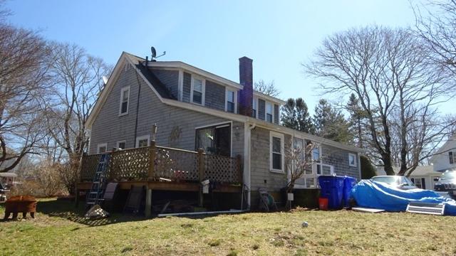 19 Everett Road Buzzards Bay, MA 02532 - Photo 15 of 30 a front view of a house with a yard covered in snow