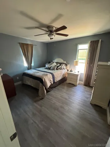 a bed room with a bed and a window