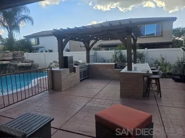 a view of a terrace with furniture