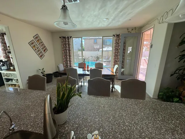 a living room with a bed furniture and a large window