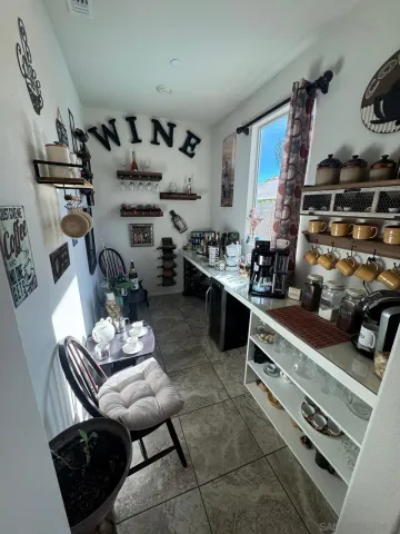 a bedroom with a bed and a potted plant