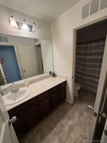 a bed room with a bed and a window