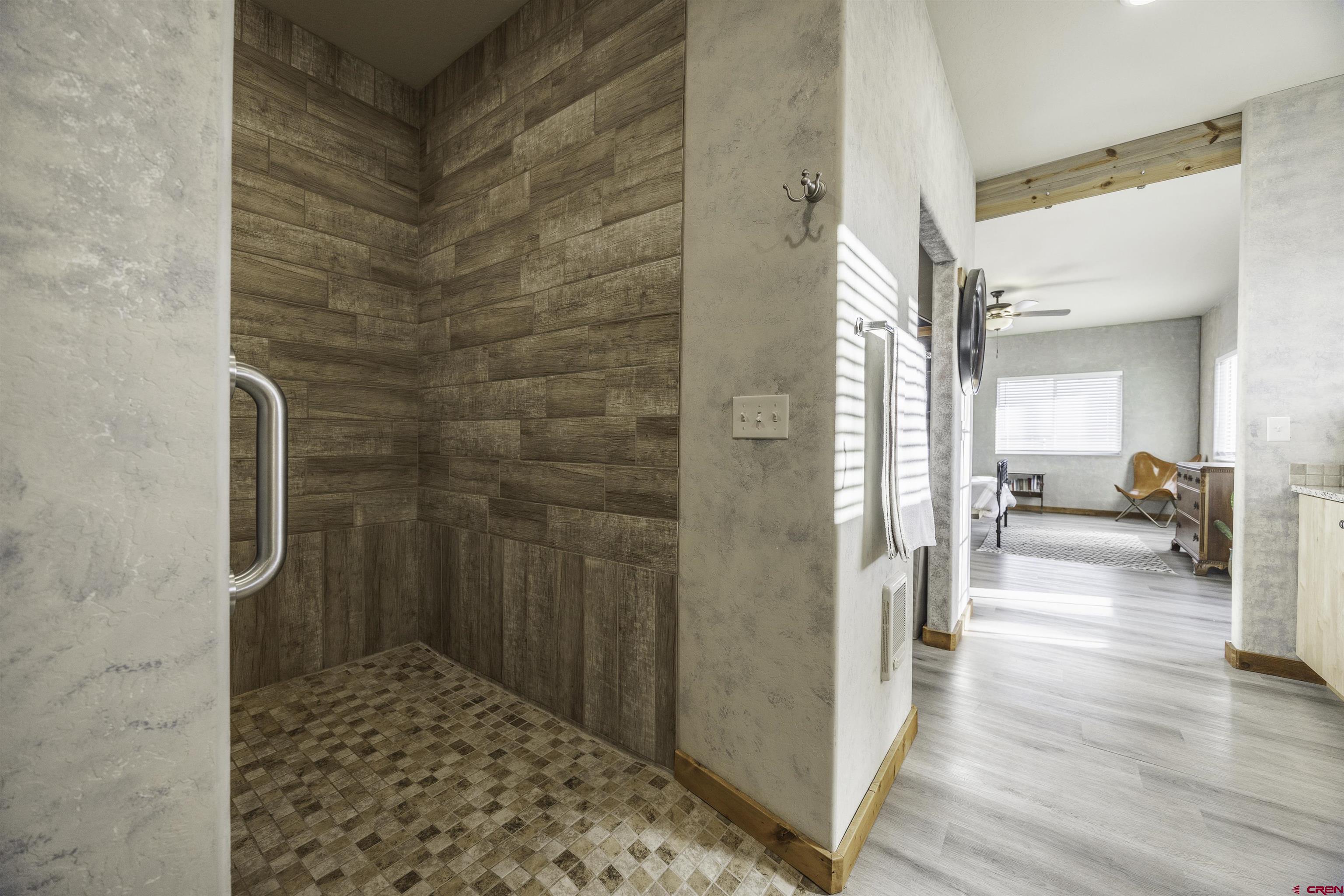 697 Grand Vista Road Delta, CO 81416 - Photo 21 of 44 a view of a hallway with wooden floor and furniture