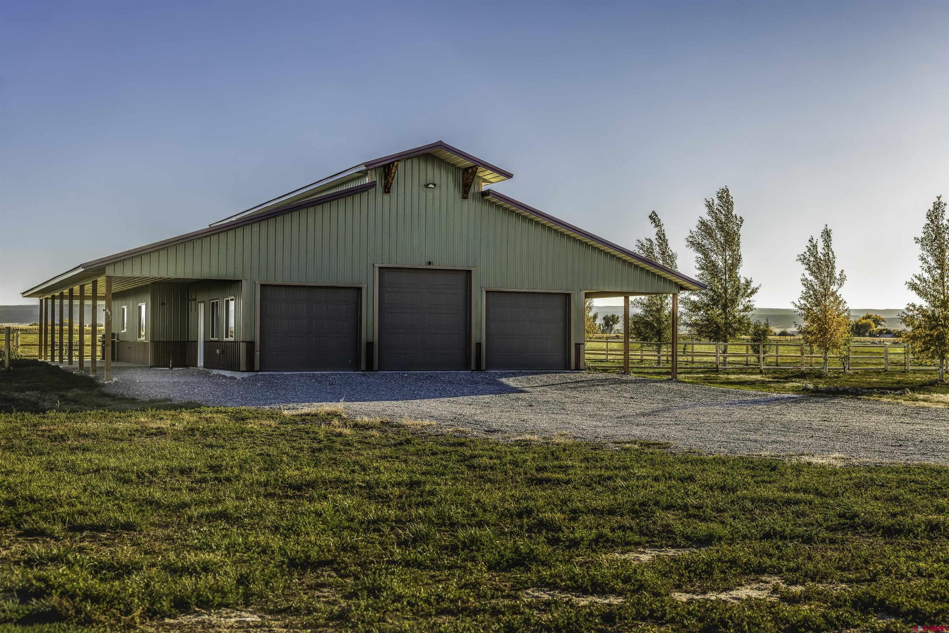 697 Grand Vista Road Delta, CO 81416 - Photo 27 of 44 a view of a house with a yard