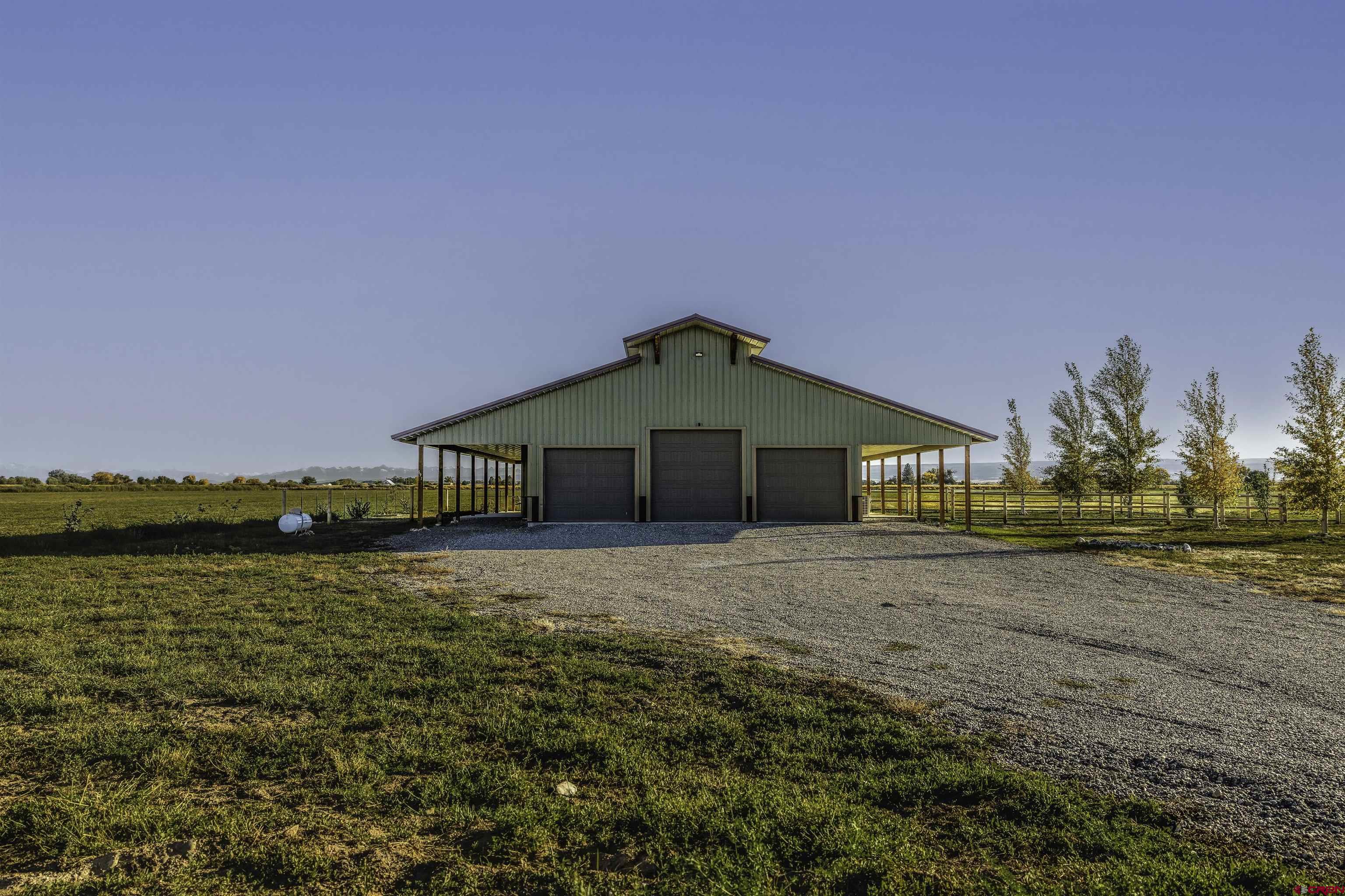 697 Grand Vista Road Delta, CO 81416 - Photo 28 of 44 a front view of a house with a yard