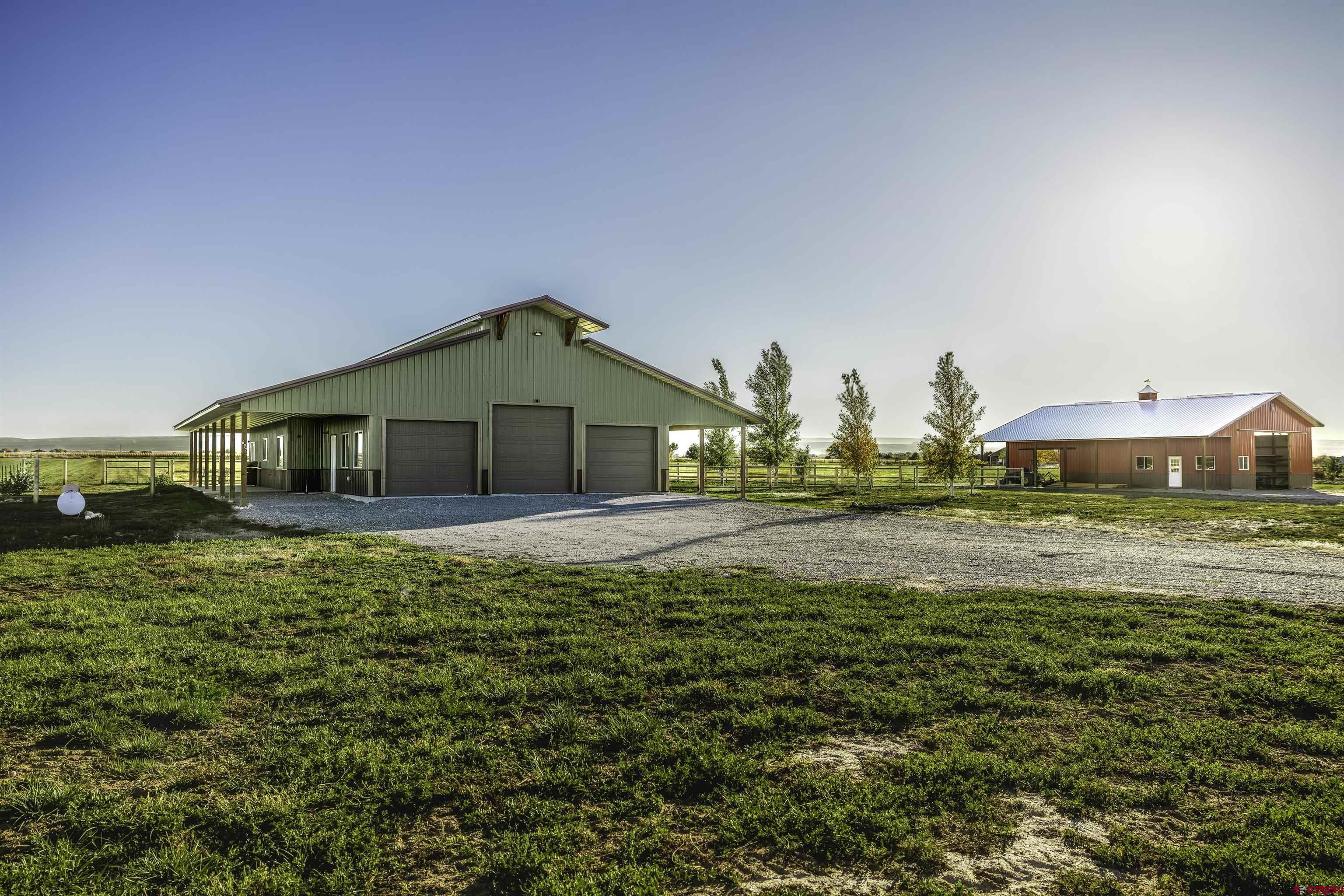 697 Grand Vista Road Delta, CO 81416 - Photo 29 of 44 a house view with swimming pool in front of it