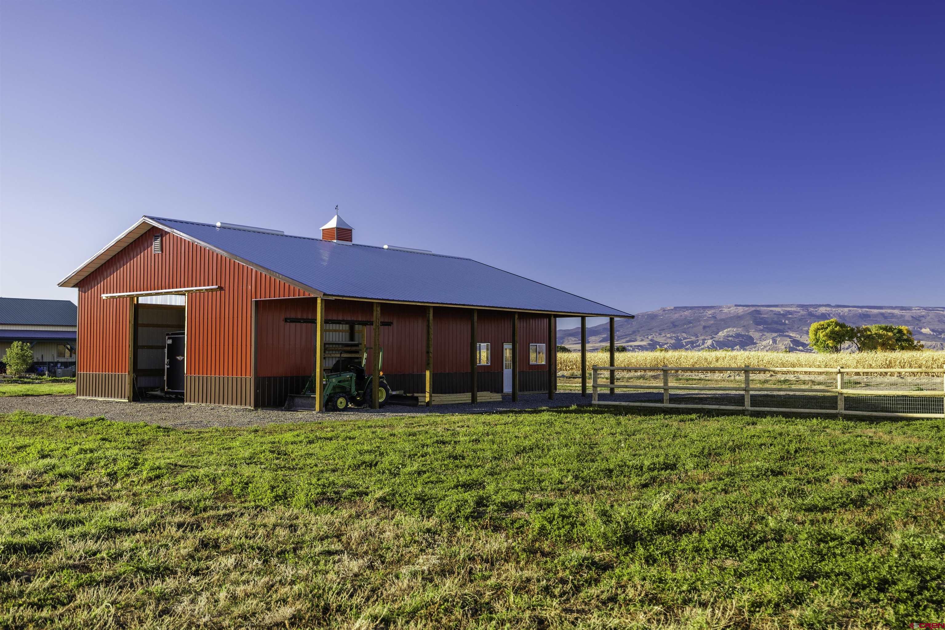 697 Grand Vista Road Delta, CO 81416 - Photo 30 of 44 a view of a house with a yard and garage