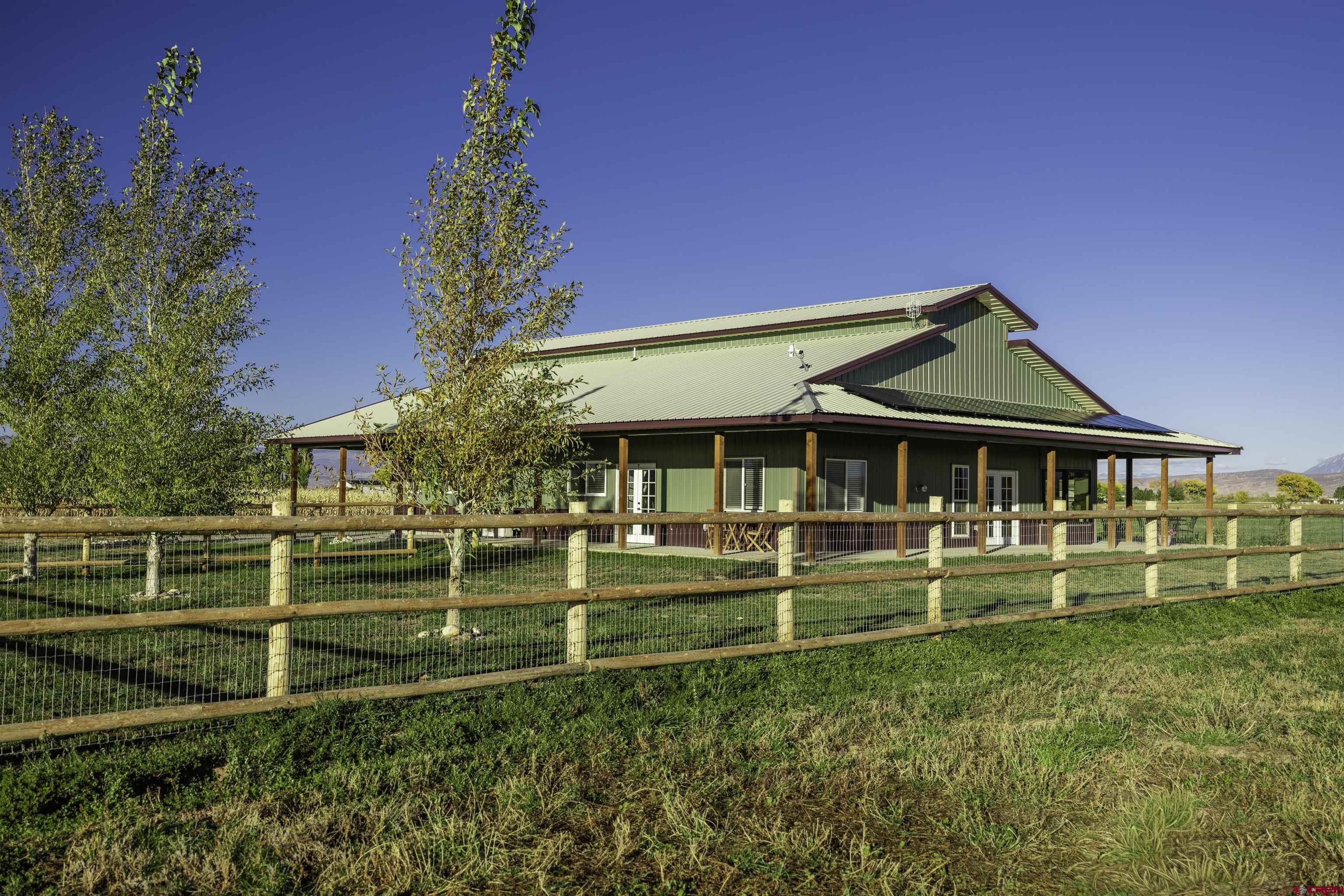 697 Grand Vista Road Delta, CO 81416 - Photo 3 of 44 front view of a house with a yard