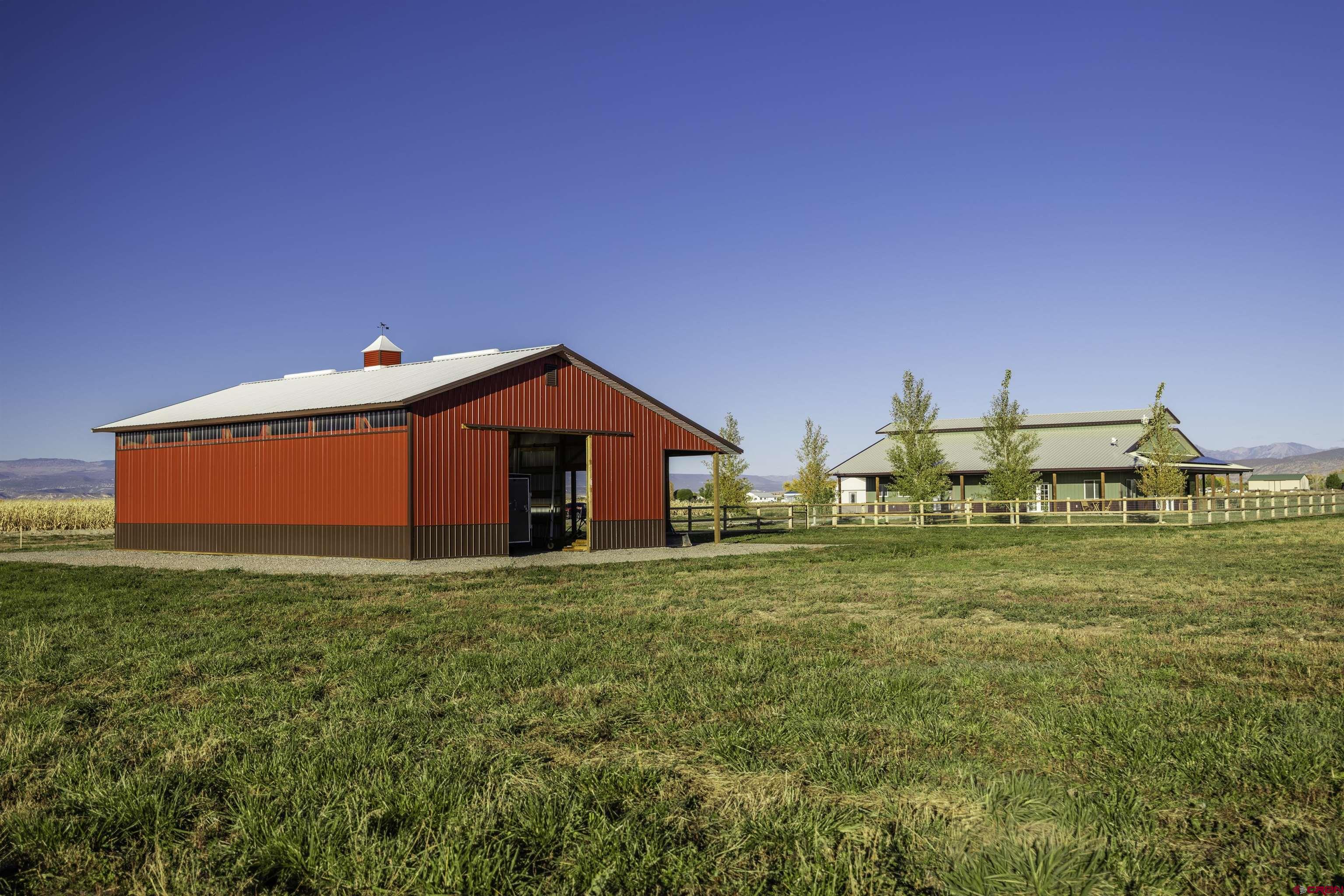 697 Grand Vista Road Delta, CO 81416 - Photo 31 of 44 a view of a house with a yard