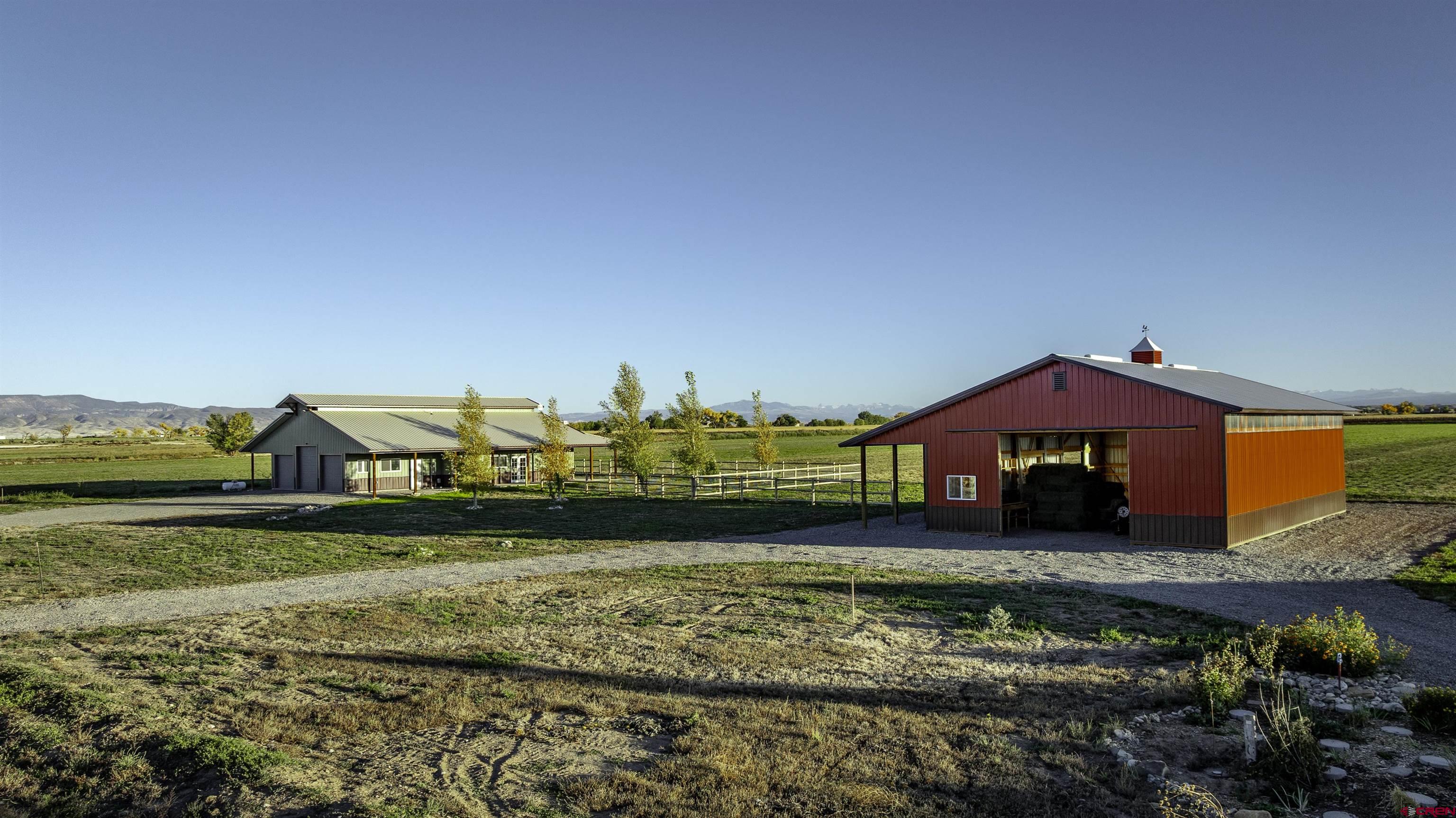 697 Grand Vista Road Delta, CO 81416 - Photo 32 of 44 a view of a houses with yard and ocean view