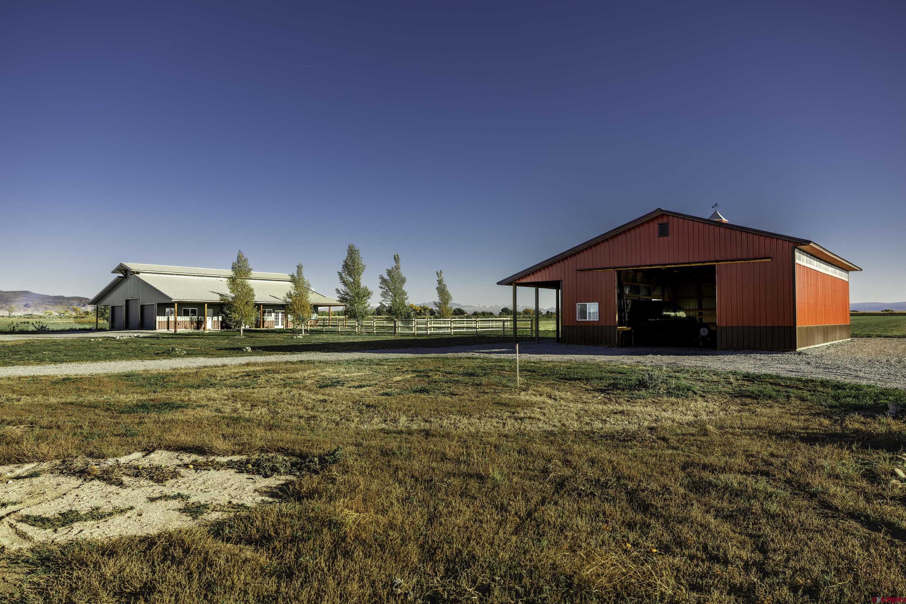 697 Grand Vista Road Delta, CO 81416 - Photo 4 of 44 a front view of a house with a yard